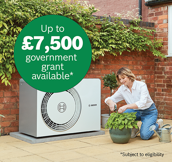 Installer with homeowner and boiler